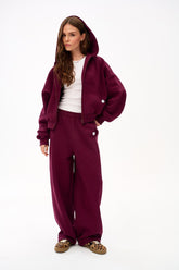 Pantaloni felpati larghi Boarding Soon