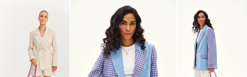 Woman in a checked blazer carrying a pink suede tote bag.