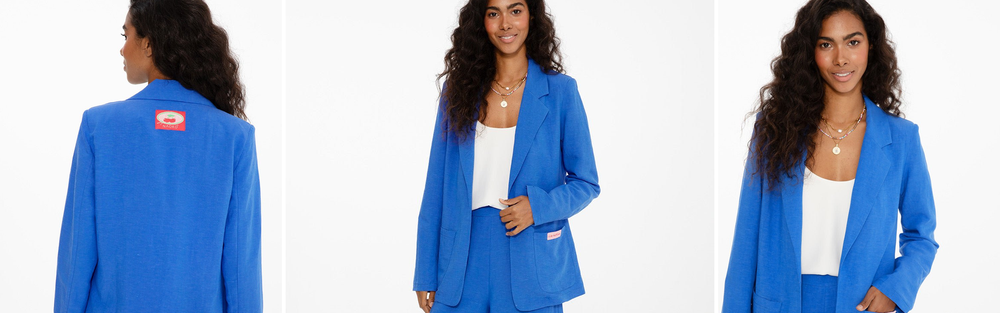 Woman in a blazer in business casual style, an office look.