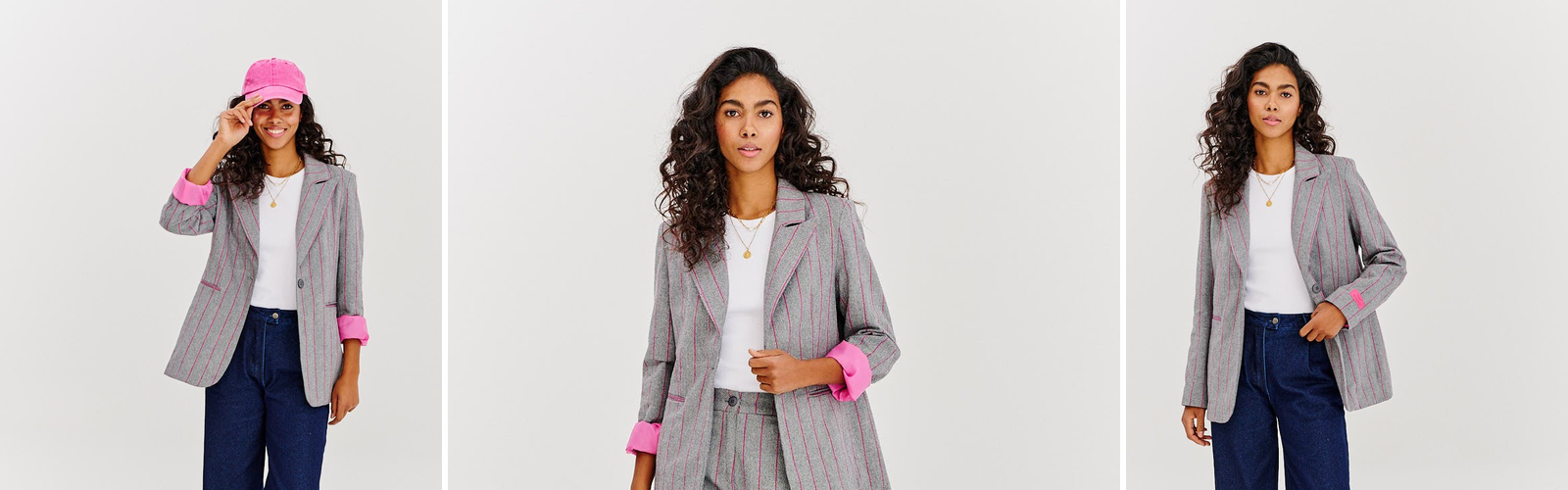 Grey pinstripe suit with contrast pink cuffs