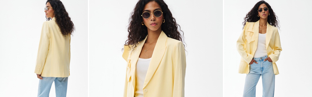 Woman in a classic blazer in old money style, discreet elegance.