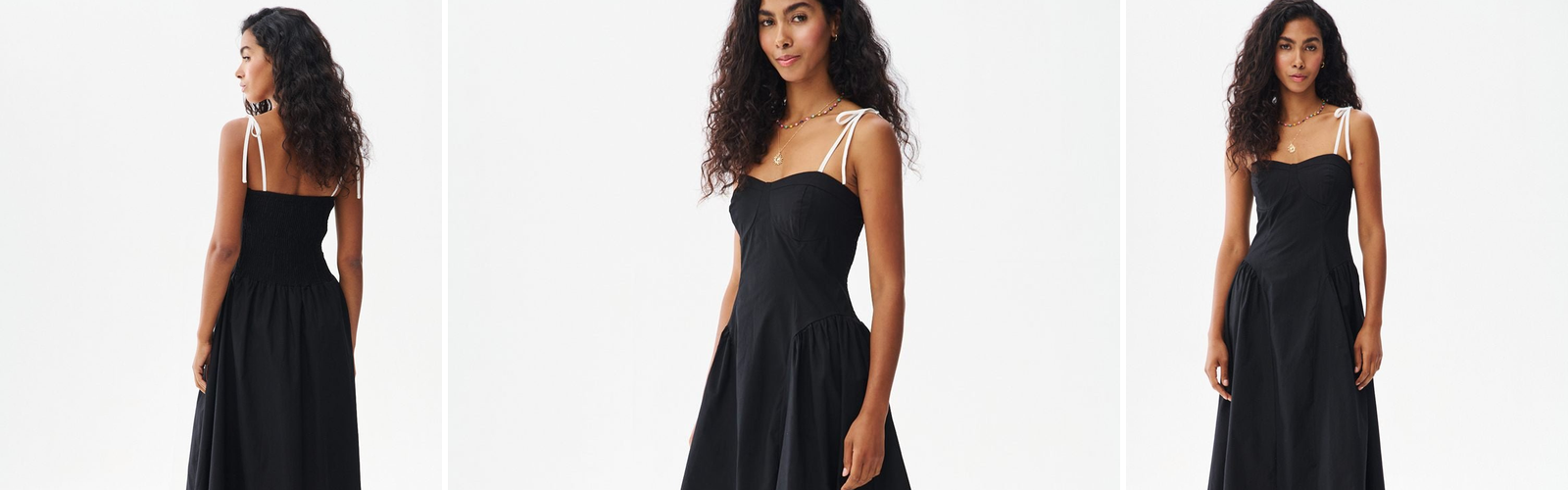 Woman in a black midi dress, an autumn evening look.