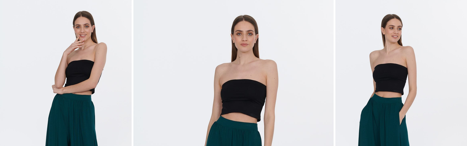 Woman in wide emerald trousers, a full length daylight view.