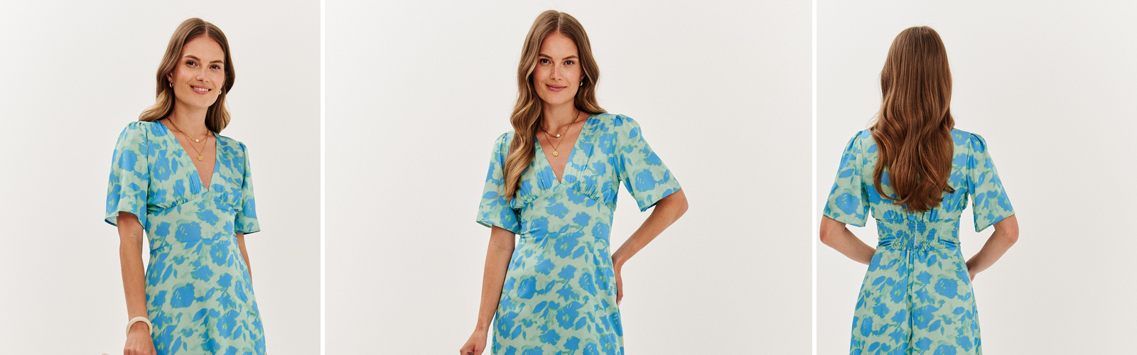 Woman in a fluid viscose midi dress with a floral print.