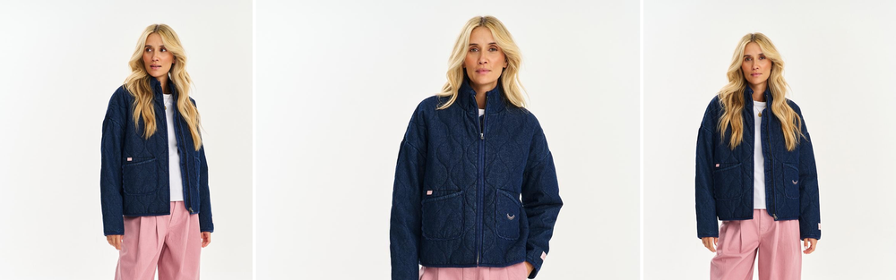 Woman in a navy quilted jacket, studio photograph