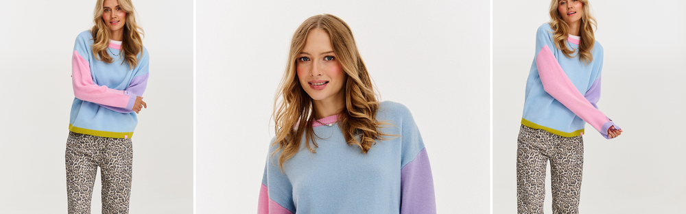 Woman in a wool sweater, banner for a guide on wearing a sweater over a dress.