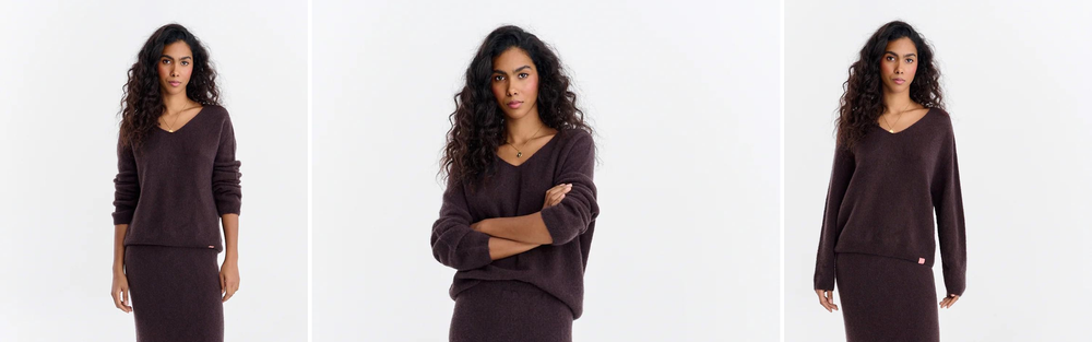 Woman in a dark brown knit sweater and matching long knit skirt, studio photograph