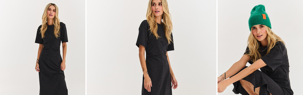 Woman in a black knitted dress against a light background, a frame showing the drape and texture of the fabric.