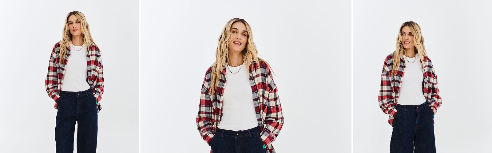 Woman in dark wide leg jeans and a checked shirt, studio photograph