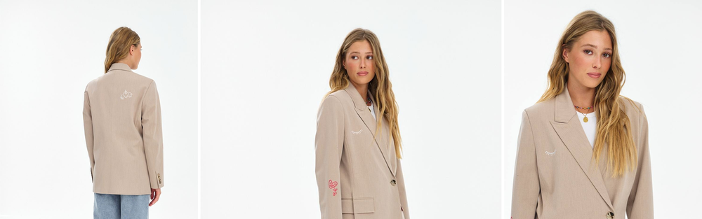 Woman in a light smooth blazer, studio photograph